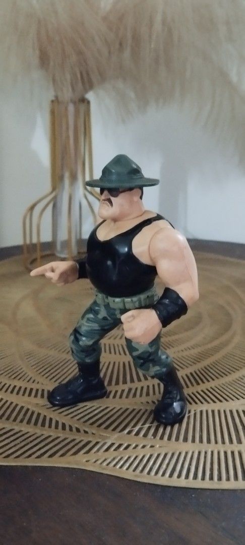 1991 Hasbro WWF Sgt. Slaughter (Category: Action & Battle Toys) located in Manila. Submitted by ventajetoyz625 (Listing ID 1447330152, Image 2). Description: - Vintage action figure - "Gimmick" working - With minimal chipped paint - Ideal for toy enthusiasts - What you see is what you get or display.