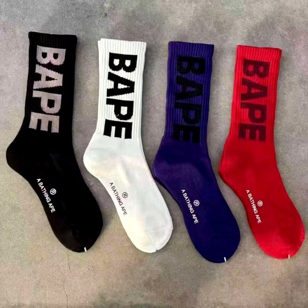 A Bathing Ape BAPE Socks (Set of 4) (Category: Socks) located in Manila. Submitted by the3rdcee01 (Listing ID 1447424161, Image 2). Description: - Set of 4 A Bathing Ape (BAPE) socks - Includes black, white, purple, and red pairs - Features the iconic BAPE logo - Ideal for streetwear fashion - All socks come with original tags and packaging.