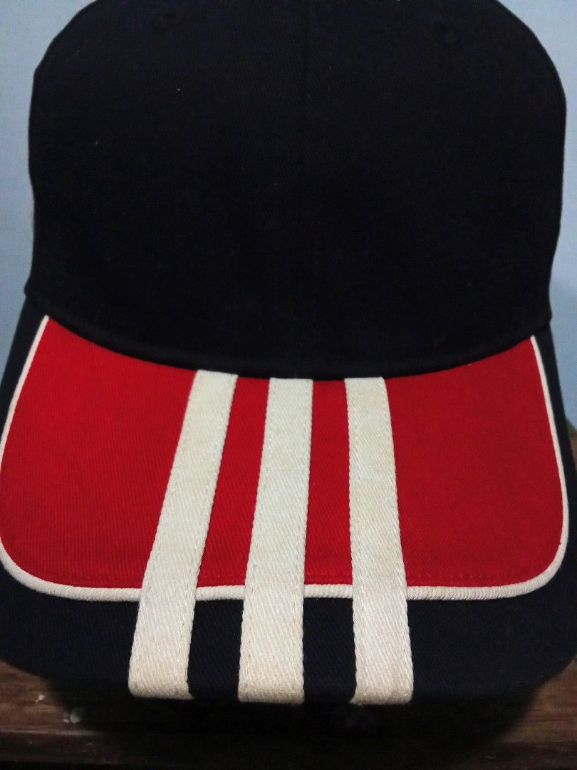 Adidas Cap Black Red White 3-Stripes (Category: Caps & Hats) located in Pagsanjan. Submitted by tomsupply (Listing ID 1447355615, Image 2). Description: - Classic Adidas cap - Iconic red and white 3-stripes on the brim - Embroidered Adidas logo on the side - Adjustable strap for a comfortable fit - Ideal for everyday style and sun protection.