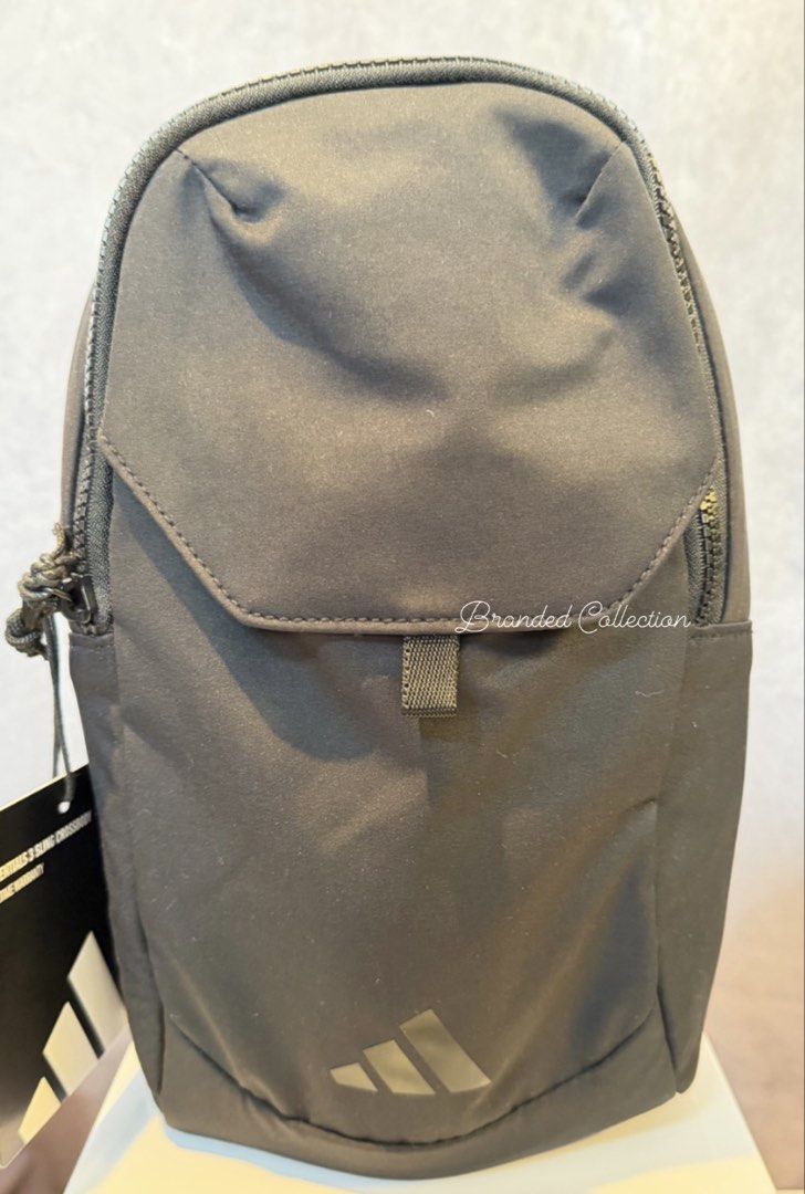 Adidas Essentials Sling Crossbody Bag - Black (Category: Sling Bags) located in Manila. Submitted by usbrandedcollections (Listing ID 1447298406, Image 1). Description: BAG-ADS-0001 Essentials 3 Sling Bag in Black, made from lightweight yet durable polyester, it includes a crossbody strap that adjusts up to 60 inches in length. There’s a pocket on the strap to keep your phone handy, plus multiple zip pockets on the bag to stash stuff. Dimension 7