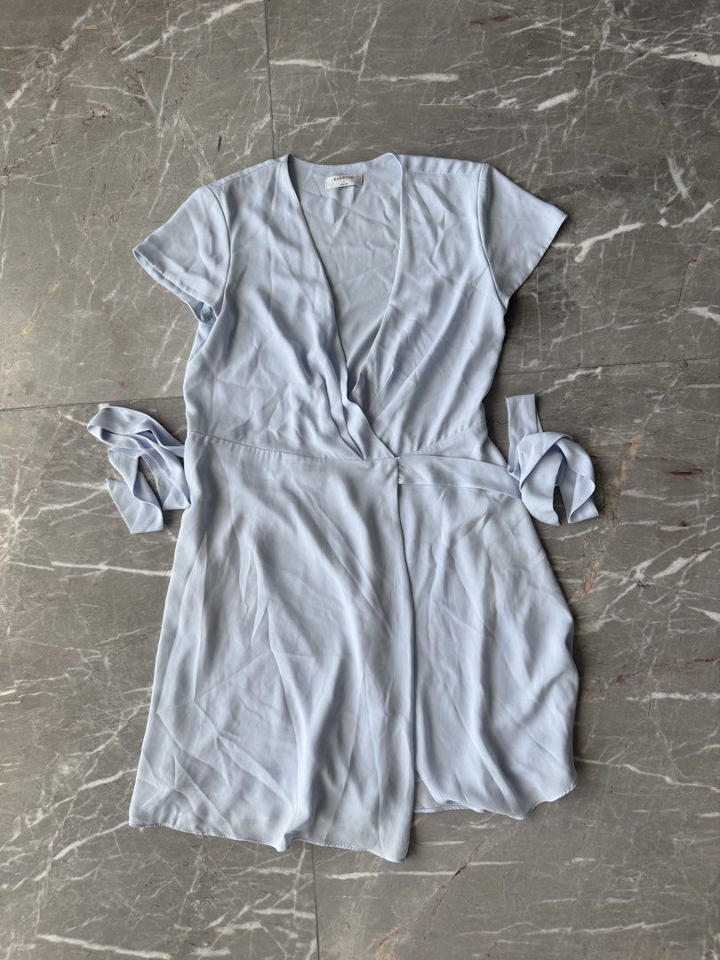 Aritzia Babaton Light Blue Wrap Dress Size S (Category: Dresses) located in Quezon City. Submitted by patpotpit (Listing ID 1447340942, Image 2). Description: - Brand: Babaton - Color: Light Blue - Style: Wrap Dress - Neckline: V-neck - Sleeves: Short with tie detail at cuffs - Closure: Self-tie waist - Size: S - Material: Light and flowy.