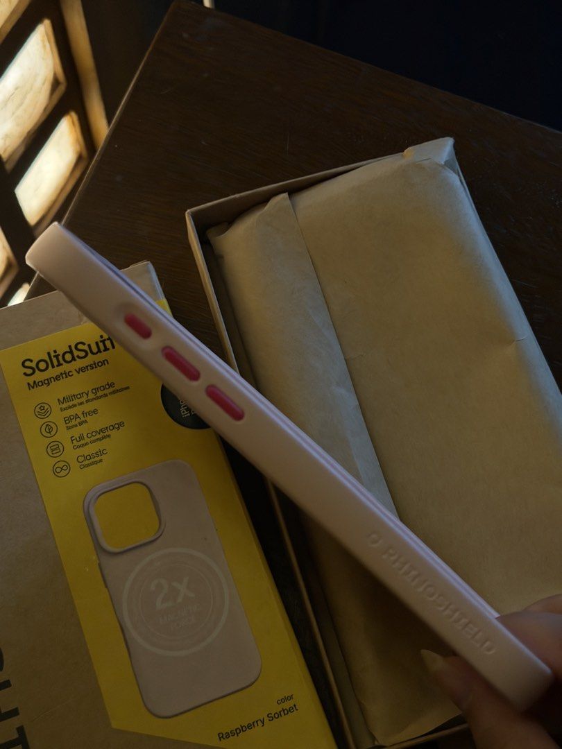 Authentic Rhinoshield SolidSuit case in Raspberry Sorbet for iPhone 16 Pro Max (Category: Cases & Sleeves) located in Caloocan City. Submitted by j777d (Listing ID 1447352028, Image 2). Description: - Authentic Rhinoshield SolidSuit case - Color: Raspberry Sorbet - Issue: Signs of yellowing - Magnetic version (MagSafe compatible) - Military-grade protection - Full coverage - Original price is 3,590.