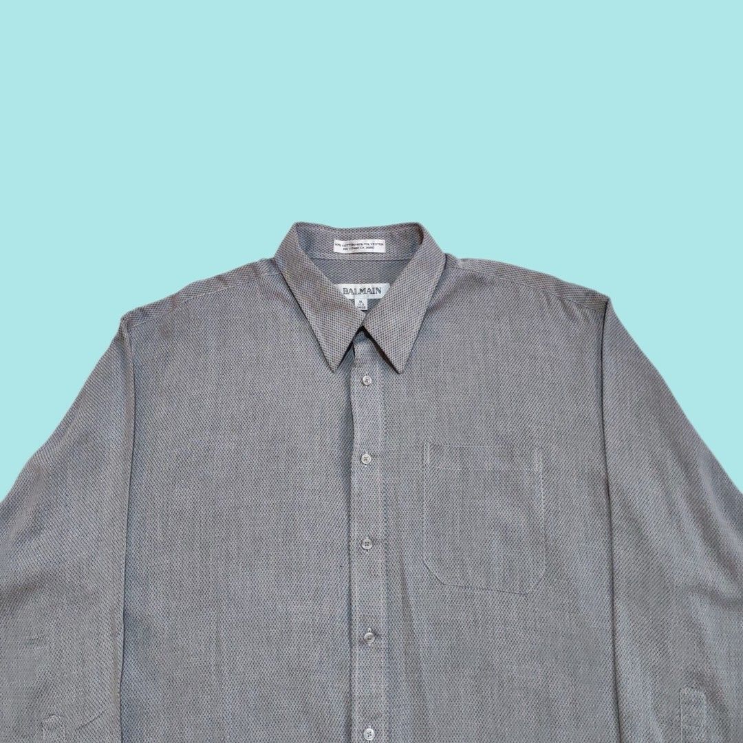 BALMAIN Men's Long Sleeve Shirt (Category: Tshirts & Polo Shirts ) located in Dinalupihan. Submitted by senkustuff (Listing ID 1447336260, Image 2). Description: - Brand: BALMAIN - Color: Grey patterned - Style: Long sleeve dress shirt - Material: 60% Cotton, 40% Polyester - Size: XL (fits 17.5 neck, 34/35 sleeve) - Features: Button-up front, chest pocket, classic collar - Occasion: Work, smart casual - Origin: Made in China Dimes Length:30 Width