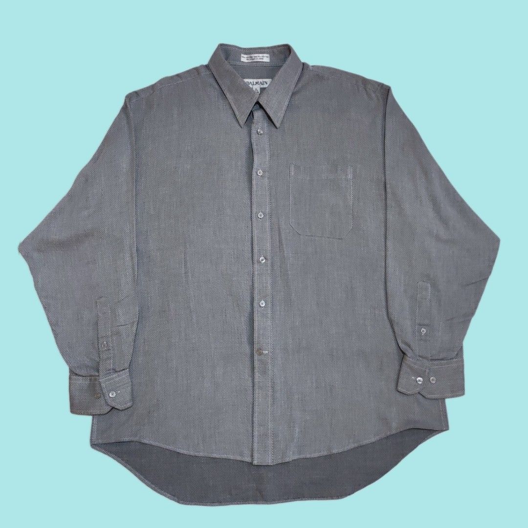 BALMAIN Men's Long Sleeve Shirt (Category: Tshirts & Polo Shirts ) located in Dinalupihan. Submitted by senkustuff (Listing ID 1447336260, Image 1). Description: - Brand: BALMAIN - Color: Grey patterned - Style: Long sleeve dress shirt - Material: 60% Cotton, 40% Polyester - Size: XL (fits 17.5 neck, 34/35 sleeve) - Features: Button-up front, chest pocket, classic collar - Occasion: Work, smart casual - Origin: Made in China Dimes Length:30 Width