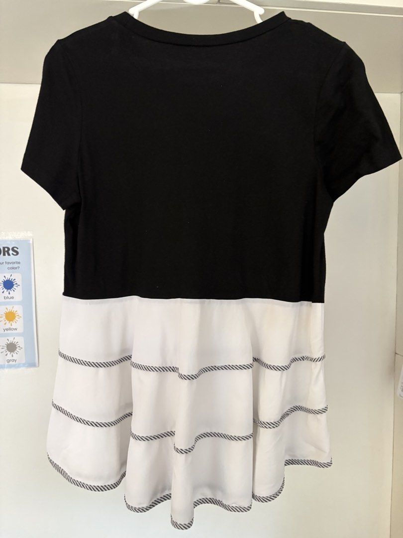 Black and White Tiered T-shirt (Category: Tshirts & Polo Shirts ) located in Muntinlupa City. Submitted by take2mnl (Listing ID 1447368541, Image 2). Description: - Black top with a contrasting white tiered bottom. - Fits small to medium frame - White tier features delicate decorative stitching. - Short sleeves for a comfortable fit. - Simple yet chic design. - Ideal for everyday casual wear..