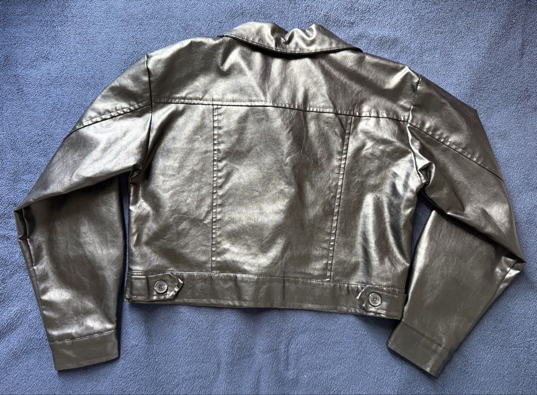 Black Cropped Leather Jacket (Category: Coats, Jackets and Outerwear) located in Caloocan City. Submitted by lysomuch (Listing ID 1447342557, Image 3). Description: - Black leather jacket - Cropped style - Button closure - Two chest pockets - Button cuffs - Versatile for layering or standalone wear - Adds shine to any outfit.