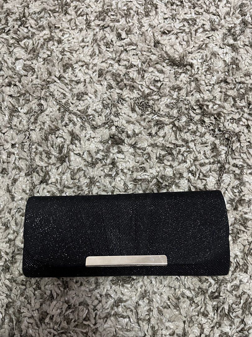 Black Glitter Clutch Bag with Silver Chain (Category: Clutches) located in Pasay City. Submitted by losient (Listing ID 1447453629, Image 1). Description: - Stunning black glitter clutch bag - Elegant silver chain strap included - Secure magnetic snap closure - Convenient interior compartments - Ideal for evening events and special occasions - Meticulously cleaned inside and out.