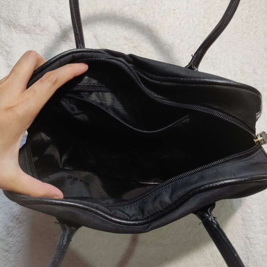 Black Plain Vintage Thick Canvas/Nylon Shoulder Bag (Category: Shoulder Bags) located in Bacoor. Submitted by kmrynl (Listing ID 1447380421, Image 3). Description: Rfs: decluttering - issue: small green paint (see photos) - thick material, spacious - see last photos for measurements (in) MOP: Gcash/BPI/Maribank only MOD: J&T/Lalamove.