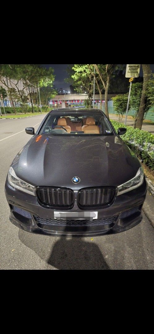 BMW 7 Series 740Li M Sport [2016] (A) (Category: Used Cars) located in Singapore. Submitted by gtr88 (Listing ID 1447389613, Image 2). Description: Dark grey BMW 7 Series sedan. Tan leather interior. Alloy wheels. Looks sleek and well-maintained. Ready for a new owner. Feel free to ask questions..