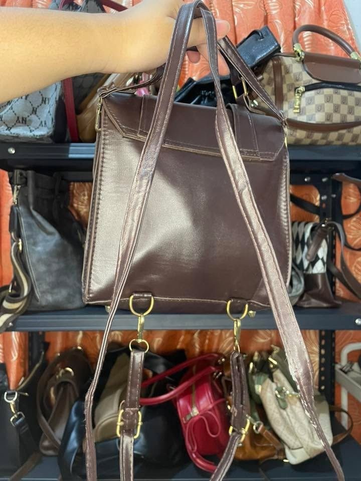 Brown Leather Backpack M Size (Category: Backpacks) located in Taytay. Submitted by PrelovedCollections (Listing ID 1447387537, Image 2). Description: - Brown leather backpack - Medium size - Top handle and adjustable straps - Gold hardware details - Ample interior space - Ideal for everyday use.
