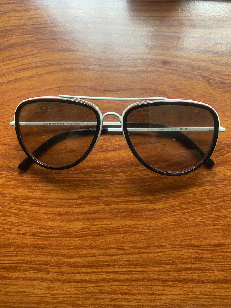 Burberry Sport Aviator Sunglasses (Category: Sunglasses & Eyewear) located in Manila. Submitted by spendinghabits (Listing ID 1447330402, Image 1). Description: Shipping fee will be shouldered by buyer. J&T/Grab/Lalamove/LBC MOP:GCash/Maya/BPI/BDO/GoTyme/Maribank - Burberry Sport aviator sunglasses - Made in Italy - White frame with red accents - Tinted lenses - Minor smudges on lenses - Ideal for sunny weather.