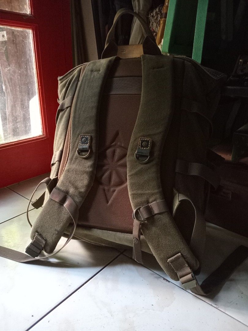 National Geographic Camera Backpack (Category: Backpacks) located in Cagayan de Oro. Submitted by joven.uy86-31596 (Listing ID 1447315153, Image 3). Description: - Olive green canvas backpack - Dark blue leather accents - Wide-opening main compartment - Interior orange lining with mesh pockets - Padded shoulder straps for comfort - Secure buckle closures on front flap - Ideal for everyday use or travel.