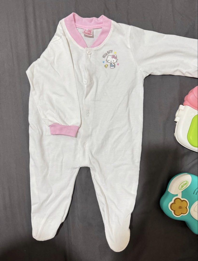 Carter's & Hello Kitty Baby Rompers (3 Months) (Category: Babies & Kids Fashion) located in Makati City. Submitted by bubba18 (Listing ID 1447318357, Image 1). Description: - Two adorable baby rompers, perfect for your little one! - Size: 3 months - Romper 1: White with pink trim and a cute Kitty graphic. - Romper 2: Pink and orange floral print, branded Carter's. - Both rompers are long-sleeved and footed. - Ideal for everyday wear and comfortab