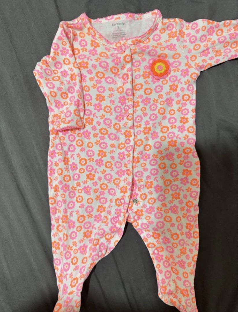 Carter's & Hello Kitty Baby Rompers (3 Months) (Category: Babies & Kids Fashion) located in Makati City. Submitted by bubba18 (Listing ID 1447318357, Image 2). Description: - Two adorable baby rompers, perfect for your little one! - Size: 3 months - Romper 1: White with pink trim and a cute Kitty graphic. - Romper 2: Pink and orange floral print, branded Carter's. - Both rompers are long-sleeved and footed. - Ideal for everyday wear and comfortab