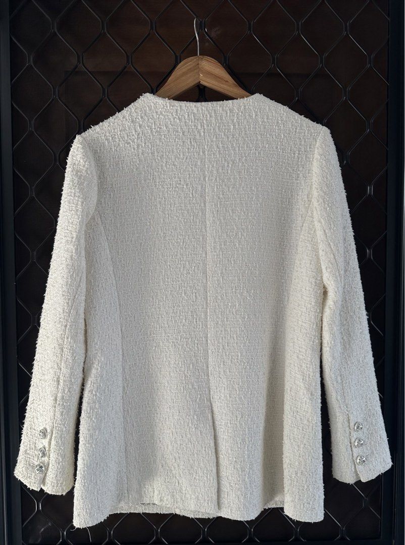 Chanel SS23 Classic Round Neck Tweed Jacket (Category: Coats, Jackets and Outerwear) located in Pasig City. Submitted by worn2wice (Listing ID 1447370725, Image 2). Description: Size 36 fits small Measurements: W 18 L 27 S 23 Excellent condition Needs dry cleaning.