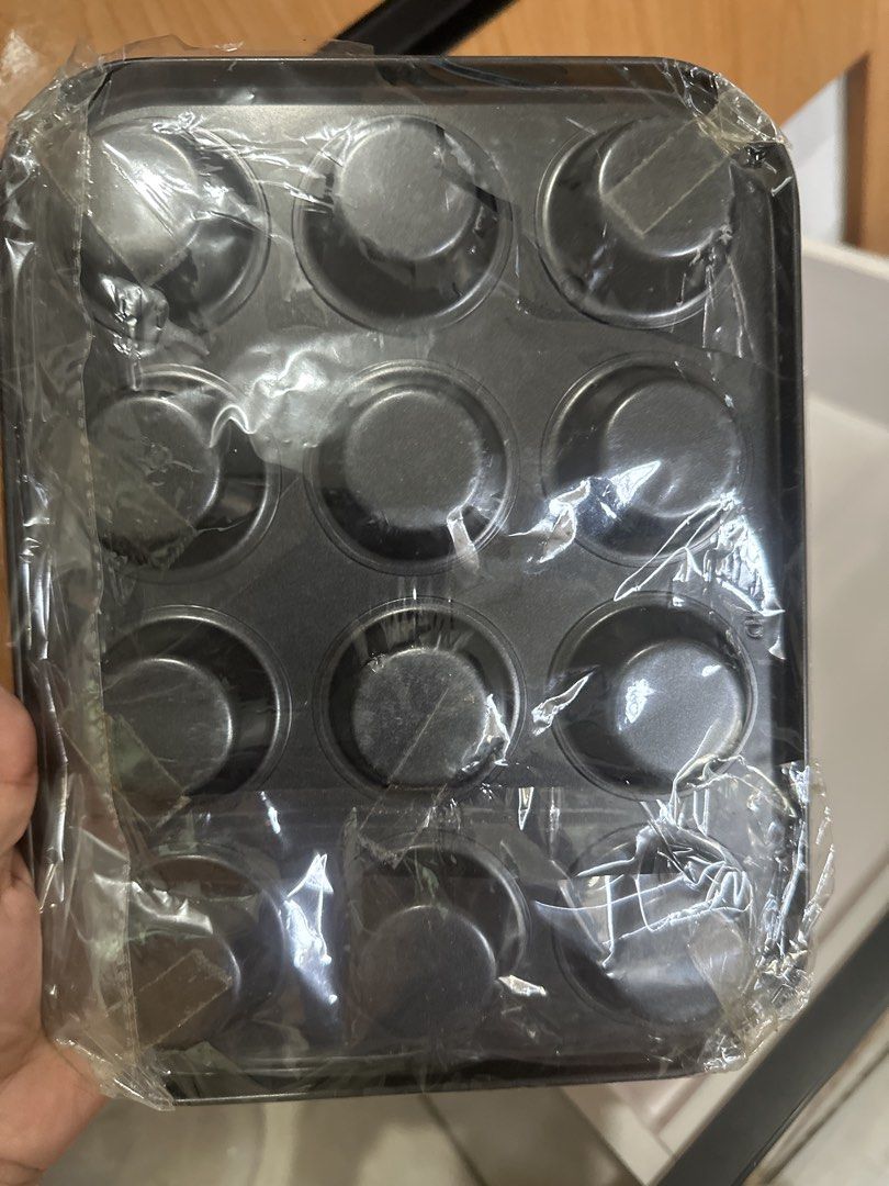 Chef Made - Mini Muffin 12 cup pan (Category: Bakeware) located in San Pedro. Submitted by Graceleen (Listing ID 1447295041, Image 2). Description: - Brand: Chef Made - Type: Mini Muffin Pan - Capacity: 12 cups - Feature: Non-stick surface for easy release and cleaning - Condition: Brand new.