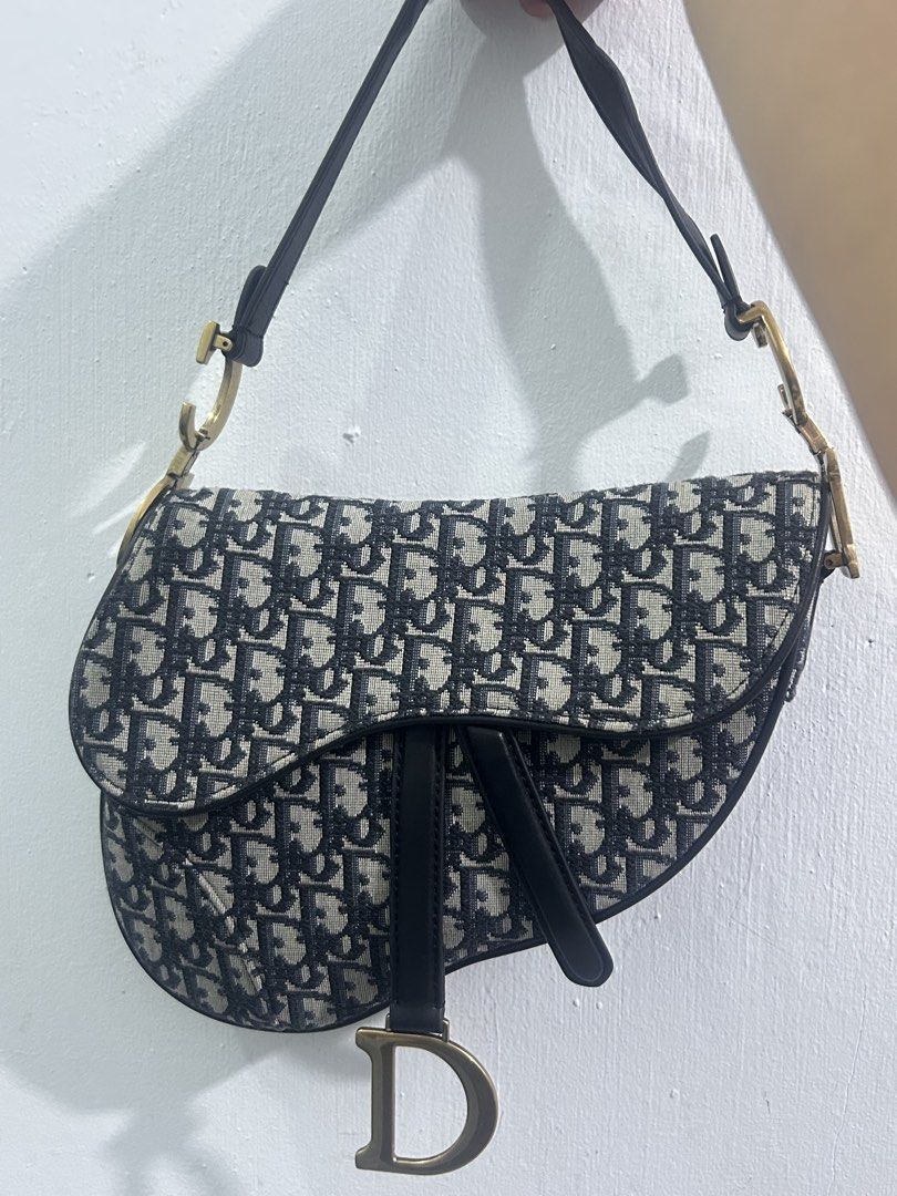 Christian Dior Saddle Bag Oblique Canvas (Category: Luxury Bags & Wallets) located in Manila. Submitted by yanamariea81956 (Listing ID 1447431115, Image 1). Description: - Classic Dior Saddle Bag - Iconic Oblique Canvas - Leather Trim and Strap - Gold-tone Hardware with CD Charm - Interior Zip Pocket - Made in Italy - Ideal for Everyday Use.