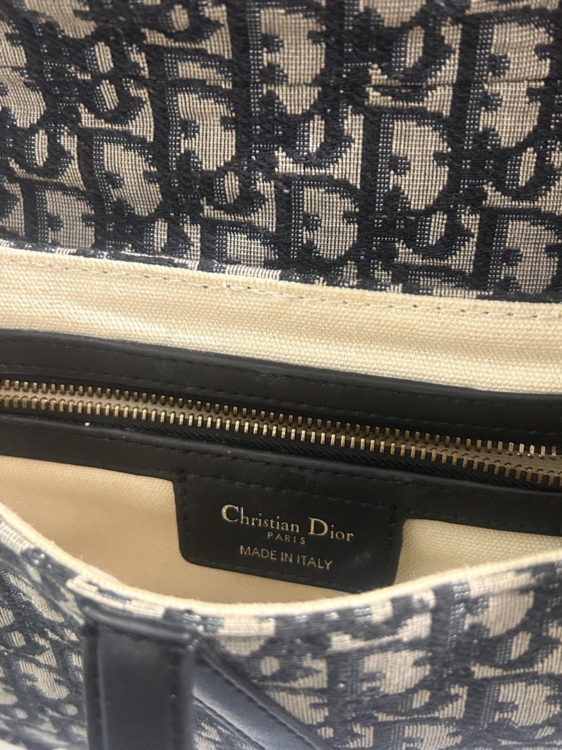 Christian Dior Saddle Bag Oblique Canvas (Category: Luxury Bags & Wallets) located in Manila. Submitted by yanamariea81956 (Listing ID 1447431115, Image 3). Description: - Classic Dior Saddle Bag - Iconic Oblique Canvas - Leather Trim and Strap - Gold-tone Hardware with CD Charm - Interior Zip Pocket - Made in Italy - Ideal for Everyday Use.