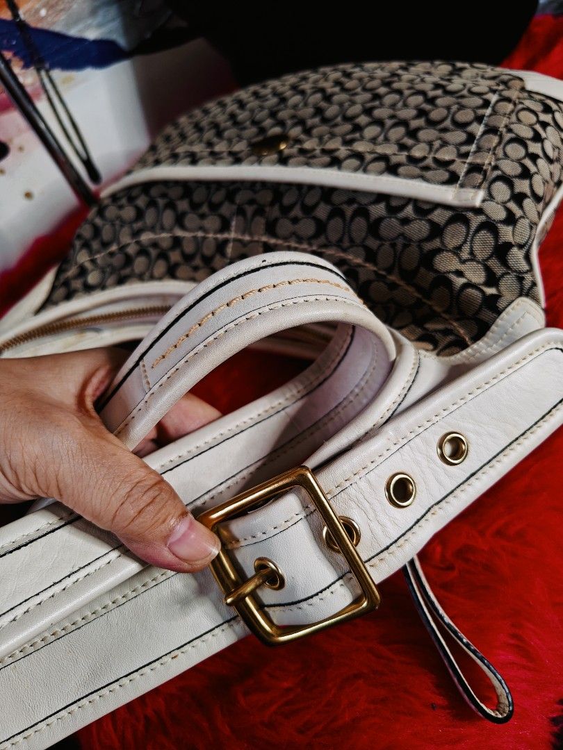 Coach Monogram Canvas & Leather Shoulder Bag (Category: Luxury Bags & Wallets) located in Las Pinas. Submitted by liezel49 (Listing ID 1447312449, Image 3). Description: - Classic Coach monogram canvas shoulder bag - White leather trim and strap - Gold-tone hardware - Front pocket with secure button closure - Main compartment with zipper closure - Ideal for everyday use - Spacious interior.