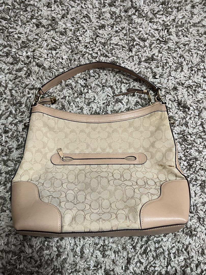 Coach Signature Monogram Shoulder Bag (Category: Shoulder Bags) located in Pasay City. Submitted by losient (Listing ID 1447451789, Image 2). Description: - Coach hobo bag - Signature monogram print in beige and tan - Leather trim and handles - Exterior zip pocket on the back - Interior slip pockets - Detachable crossbody strap included - Ideal size for everyday carry.
