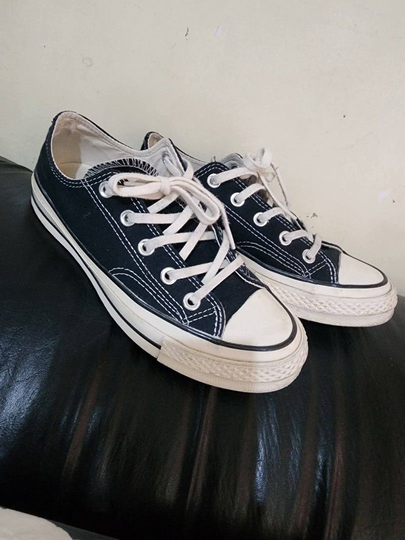 Converse Chuck Taylor All Star Low Top Black Canvas (Category: Sneakers) located in Baguio. Submitted by erreiv (Listing ID 1447415864, Image 1). Description: - Classic black Converse Chuck Taylor All Star low tops - Canvas material with white laces and rubber toe cap - White sole with some signs of wear - Iconic Chuck Taylor logo on heel - Great for everyday wear - Size: 4 UK.