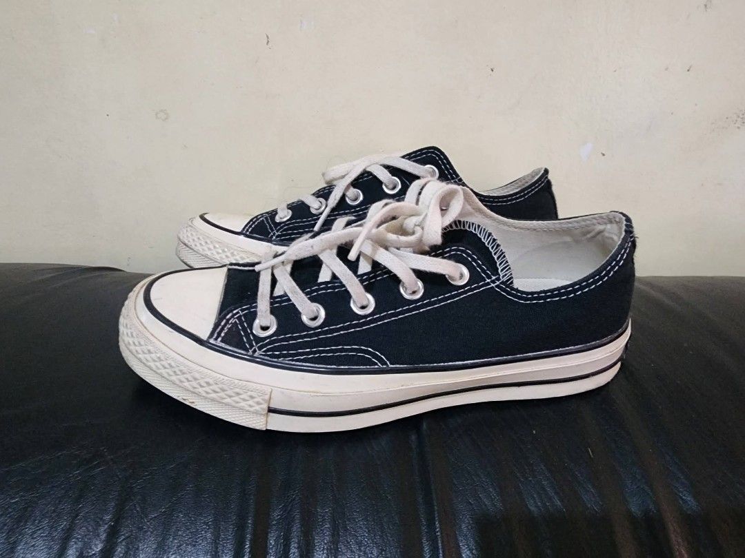 Converse Chuck Taylor All Star Low Top Black Canvas (Category: Sneakers) located in Baguio. Submitted by erreiv (Listing ID 1447415864, Image 3). Description: - Classic black Converse Chuck Taylor All Star low tops - Canvas material with white laces and rubber toe cap - White sole with some signs of wear - Iconic Chuck Taylor logo on heel - Great for everyday wear - Size: 4 UK.