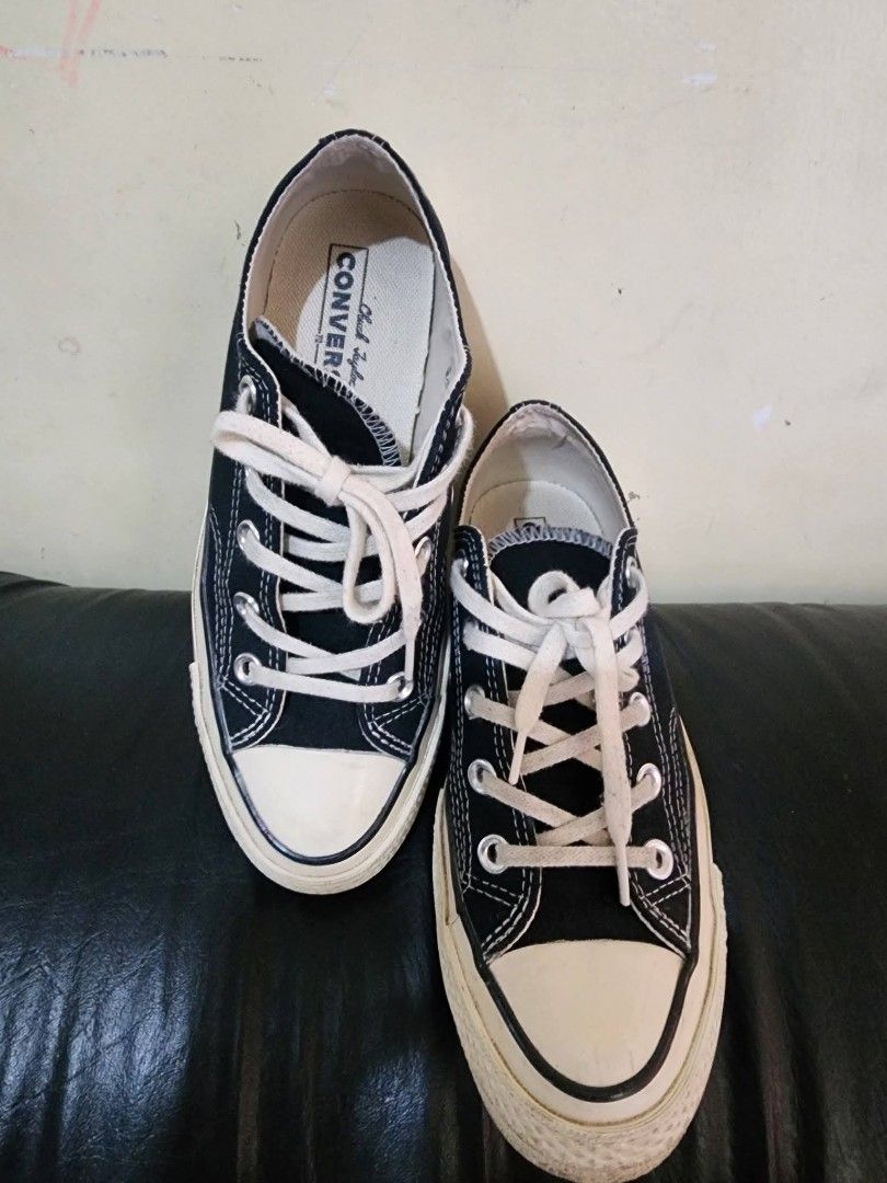 Converse Chuck Taylor All Star Low Top Black Canvas (Category: Sneakers) located in Baguio. Submitted by erreiv (Listing ID 1447415864, Image 2). Description: - Classic black Converse Chuck Taylor All Star low tops - Canvas material with white laces and rubber toe cap - White sole with some signs of wear - Iconic Chuck Taylor logo on heel - Great for everyday wear - Size: 4 UK.
