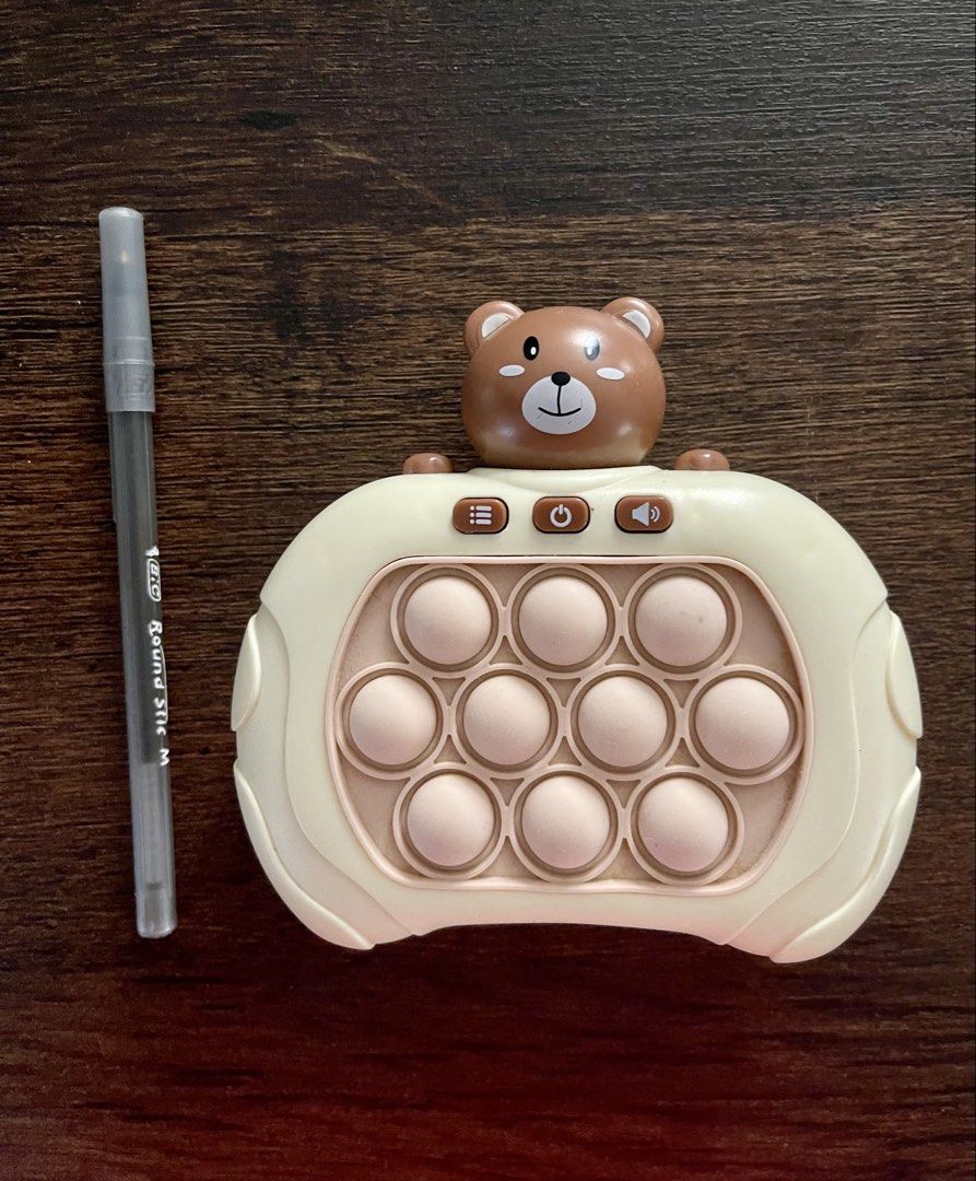 Cute Bear Pop It Fidget Toy (Category: Designer & Blind Box Toys) located in Las Pinas. Submitted by kayebee17 (Listing ID 1447320309, Image 1). Description: - Features 10 bubble pops on the front - Battery compartment located on the back .