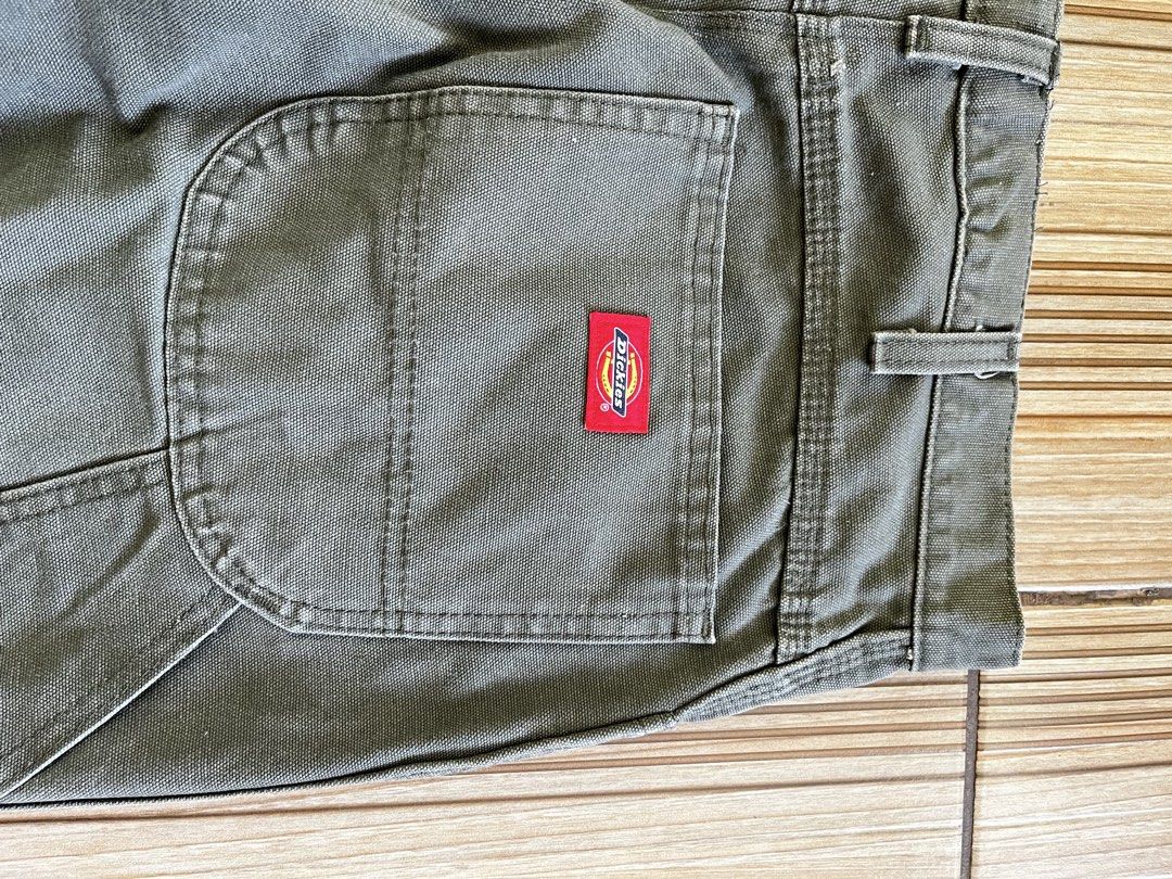 Dickies Carpenter Pants Olive Green (Category: Jeans) located in Quezon City. Submitted by _earlb (Listing ID 1447312368, Image 2). Description: - Classic Dickies carpenter pants - Nice olive green color - Durable workwear style - Iconic red Dickies logo patch on back pocket - Plenty of utility pockets - Great for everyday wear or work Measurements Waist 36 altered from 40 Leg opening 8 altered from 9 Length 39 altered from 41 Still crispy and fi