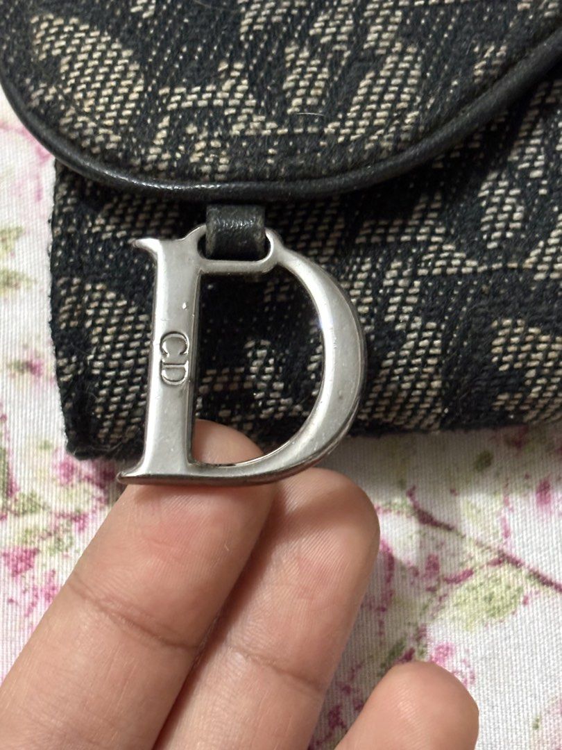 Dior Trotter Monogram Saddle Wallet (Category: Luxury Bags & Wallets) located in Iba. Submitted by luxbagsandblings (Listing ID 1447438934, Image 2). Description: 🌸Guaranteed Authentic Christian Dior Monogram Canvas Medium Wallet 💯 -Coded. (Check photos) -RANK AB, In EXCELLENT CONDITION✨(Outside part just needs a bit of cleaning. The “D” Charm have some hairline scratches which is very normal for Lightly Used wallets) Please Check Photos. -Slig
