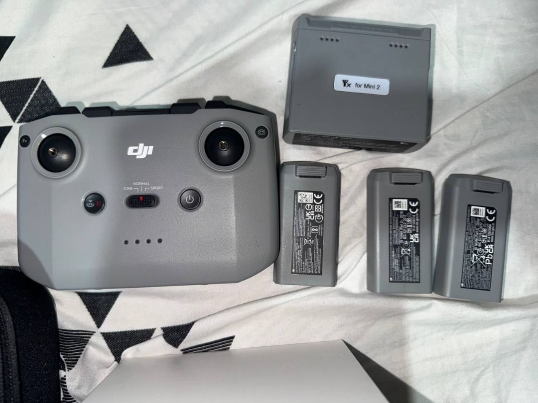 DJI Mini 4k Fly More Combo (Category: Drones) located in Binan City. Submitted by calvin654132317 (Listing ID 1447410358, Image 3). Description: - DJI Mini 4K Fly More Combo - Php 13000 Only! Used 3 Times - Ultra-lightweight drone (under 249g) - Includes drone, remote controller, and carrying case - Comes with 3 intelligent flight batteries and a multi-battery charging hub - Features eye-catching red reflective stickers for enhanced visibility - 