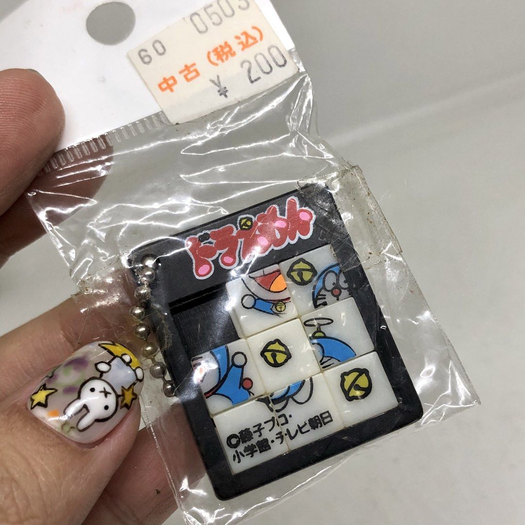DORAEMON PUZZLE GAME KEYCHAIN (Category: Character Goods) located in Quezon City. Submitted by kitsune.treasures (Listing ID 1447386641, Image 1). Description: *First to pay policy! *1 day reservation only. Failure to pay on time, auto cancel. 📍Quezon City * MOD: J&T | Lalamove * MOP: GCASH | BPI 📦ON HAND AND READY TO SHIP CONDITION: WHAT YOU SEE IS WHAT YOU GET. Dimensions: Kindly check the photos for the actual measurements. Please check all 