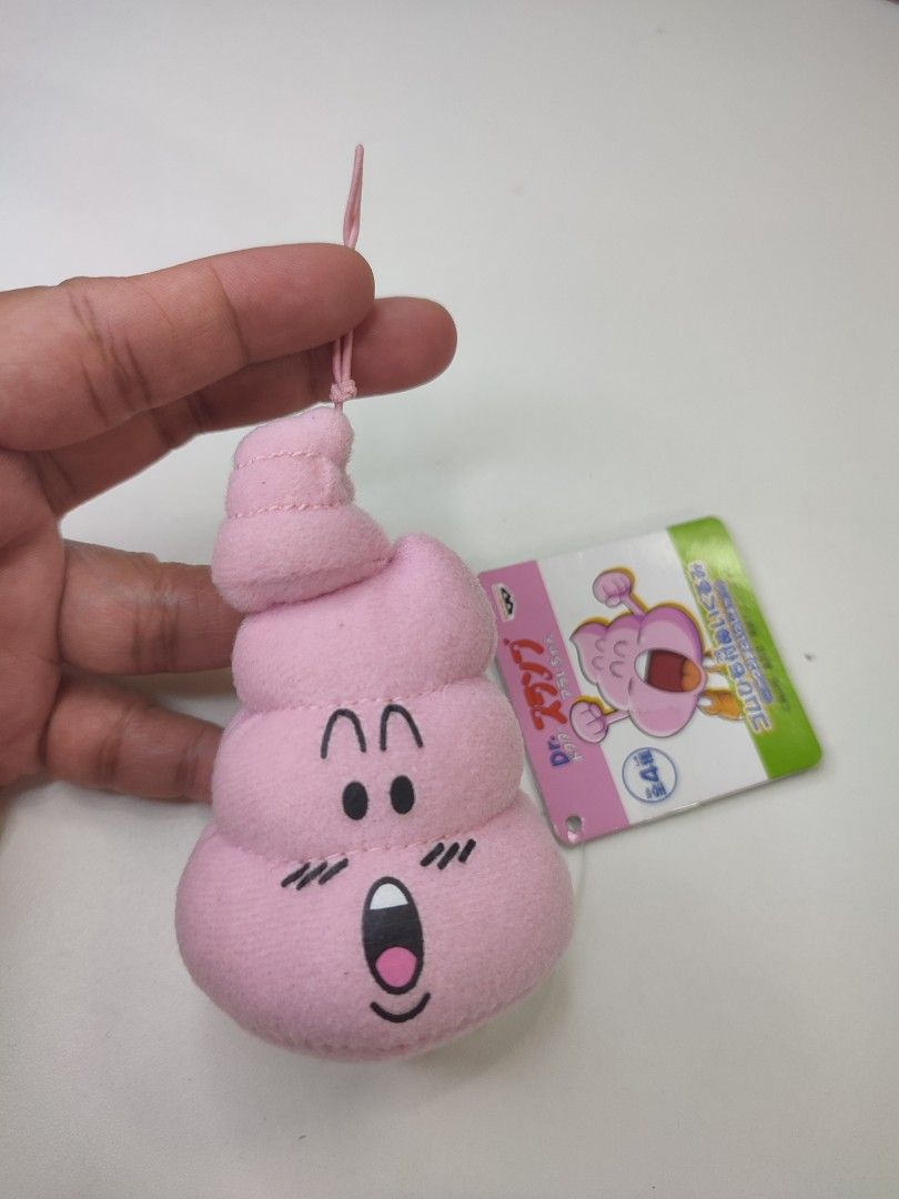 Dr. Slump Arale Pink Poop Plush Charm (Category: Plushies & Soft Toys) located in Manila. Submitted by epicmountain-f20453 (Listing ID 1447309131, Image 1). Description: - Adorable pink poop plush charm from Dr. Slump. - Features Arale's face with a surprised expression. - Comes with a loop for easy hanging. - Ideal for decorating bags or using as a keychain. - Authentic Banpresto product..