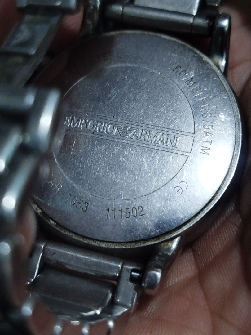 Emporio Armani Chronograph Watch (Category: Men's Watches) located in Subic. Submitted by regiedaniel01 (Listing ID 1447390266, Image 3). Description: - Emporio Armani AR-1953 Watch - Features: Black dial with chronograph functions - Band: Stainless steel - Water Resistance: 50 meters / 5 ATM - Condition: Some signs of wear on the band and casing. Please check photos for details. working .