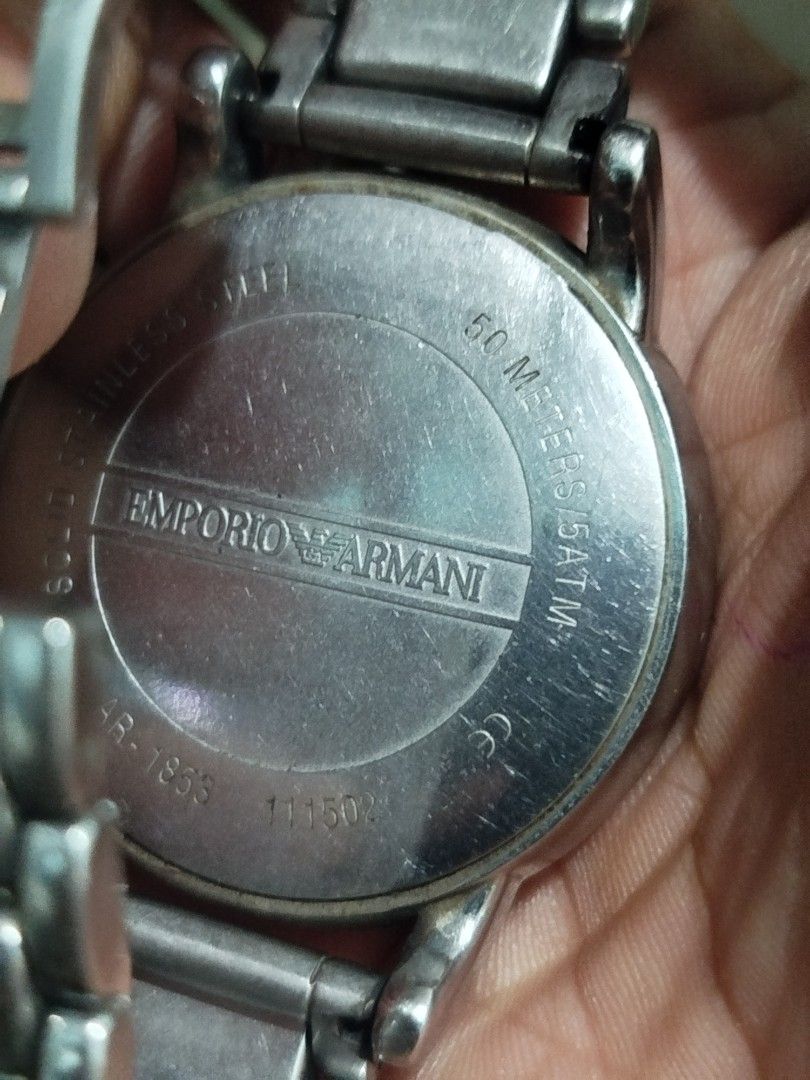 Emporio Armani Chronograph Watch (Category: Men's Watches) located in Subic. Submitted by regiedaniel01 (Listing ID 1447390266, Image 2). Description: - Emporio Armani AR-1953 Watch - Features: Black dial with chronograph functions - Band: Stainless steel - Water Resistance: 50 meters / 5 ATM - Condition: Some signs of wear on the band and casing. Please check photos for details. working .