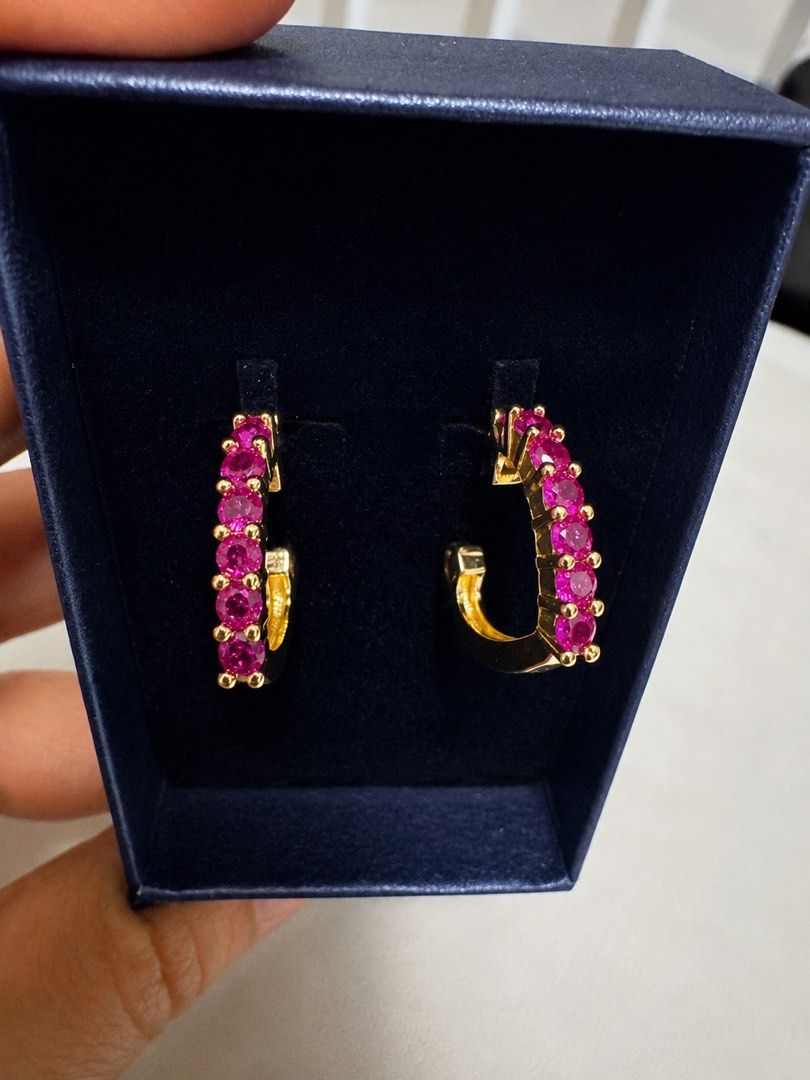 Gold Heart Hoop Earrings with Ruby Stones (Category: Earrings) located in Guagua. Submitted by dixie_1028 (Listing ID 1433274598, Image 1). Description: - Non tarnish gold setting hoop earrings - Heart-shaped design - Features ruby-colored stones - Includes navy blue box - Perfect for special occasions or everyday wear. -NOT REAL GOLD.