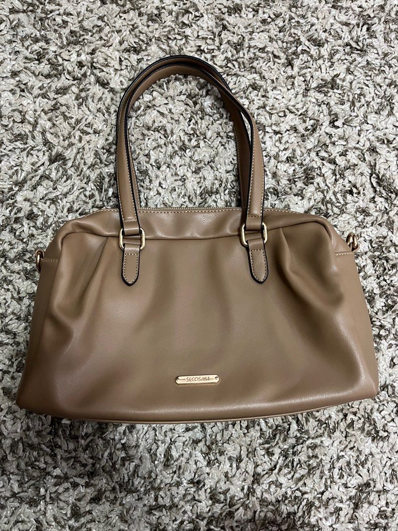 handbag, taupe, shoulder bag (Category: Shoulder Bags) located in Pasay City. Submitted by losient (Listing ID 1447451579, Image 2). Description: - Taupe shoulder bag by BECOSA - Convenient back zip pocket - Elegant gold hardware details - Four protective studs on the bottom - Comfortable shoulder straps - Ample interior space for essentials.