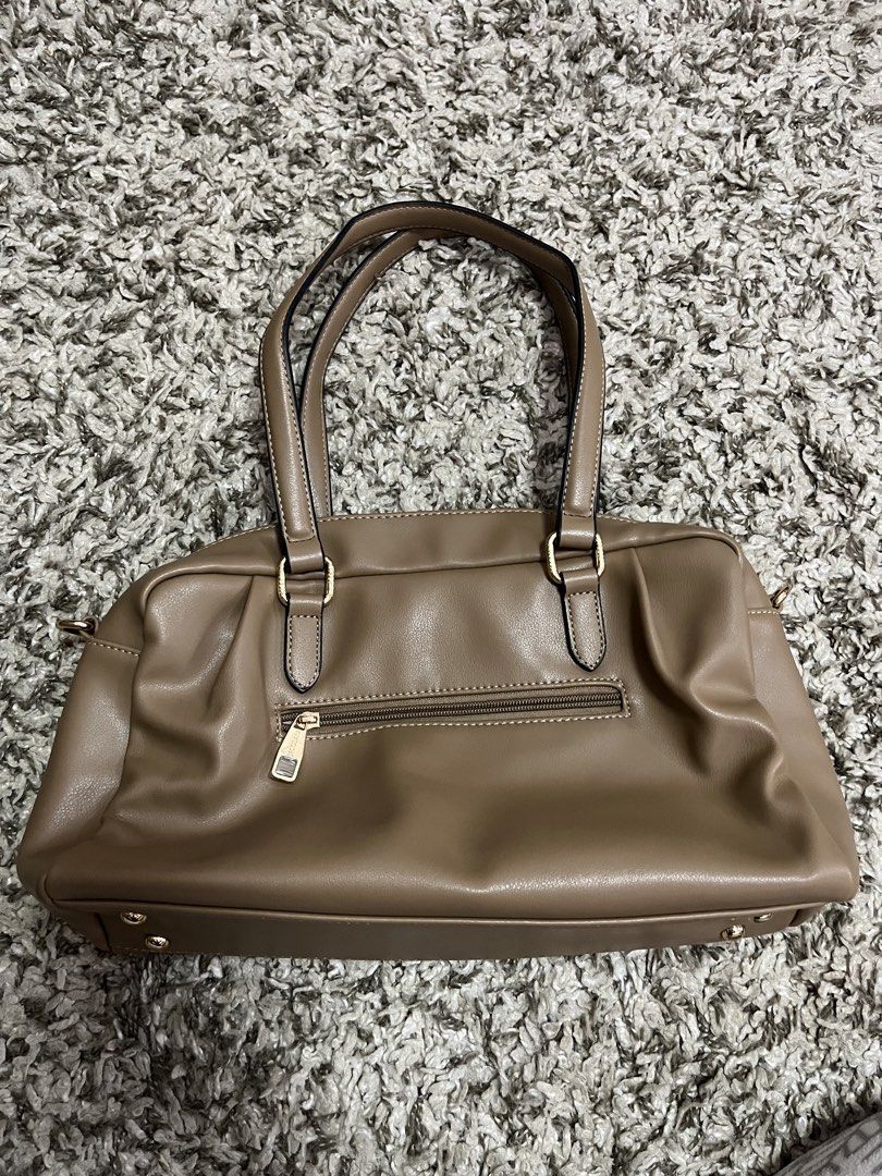 handbag, taupe, shoulder bag (Category: Shoulder Bags) located in Pasay City. Submitted by losient (Listing ID 1447451579, Image 3). Description: - Taupe shoulder bag by BECOSA - Convenient back zip pocket - Elegant gold hardware details - Four protective studs on the bottom - Comfortable shoulder straps - Ample interior space for essentials.