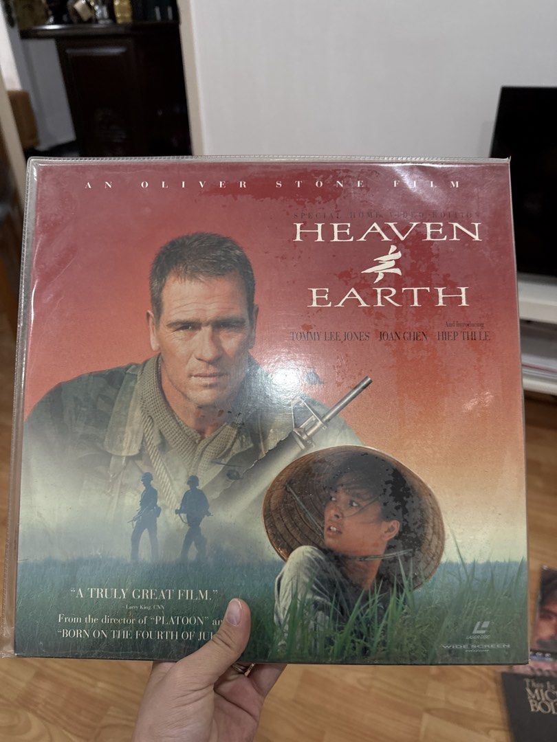 Heaven & Earth Oliver Stone Film Laserdisc laser disc LD (Category: CDs & DVDs) located in Kuala Lumpur. Submitted by nojoybidderpls (Listing ID 1447376184, Image 1). Description: - Oliver Stone film: Heaven & Earth soundtrack on LD. - Starring Tommy Lee Jones and Joan Chen. - Features songs from the movie. - Perfect for fans of Oliver Stone's work or 90s cinema. - A great film, as noted on the cover. - From the director of Platoon..