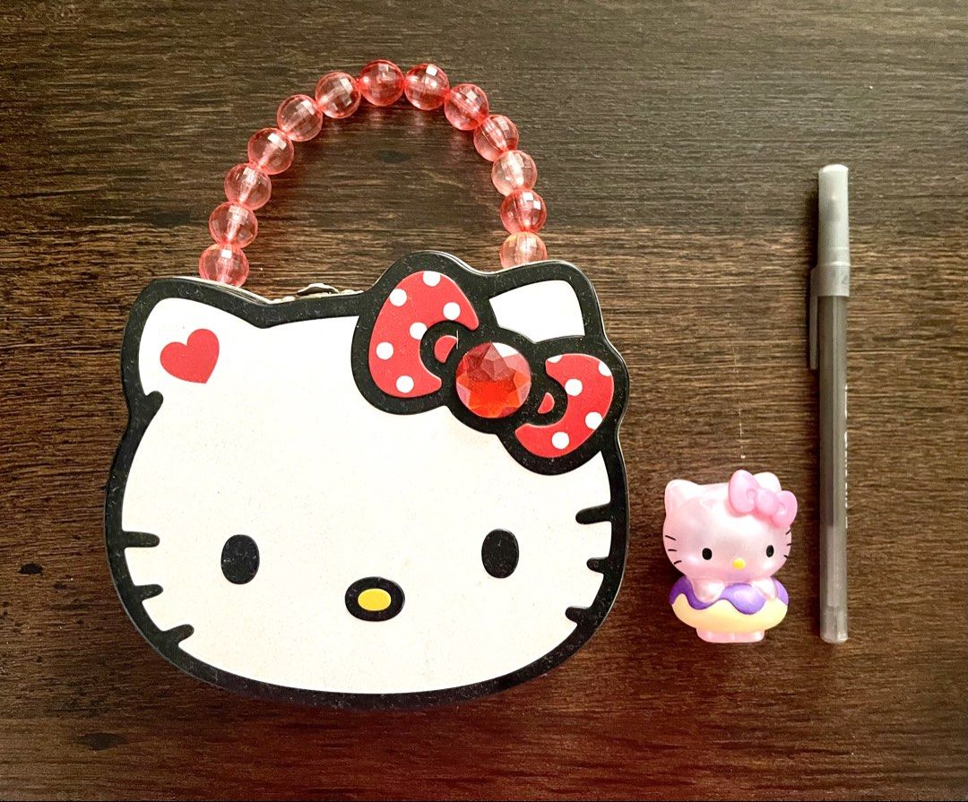 Hello Kitty Tin Box with Handle and Mini Figure (Category: Vintage Collectibles) located in Las Pinas. Submitted by kayebee17 (Listing ID 1447322865, Image 1). Description: Pen for size reference .