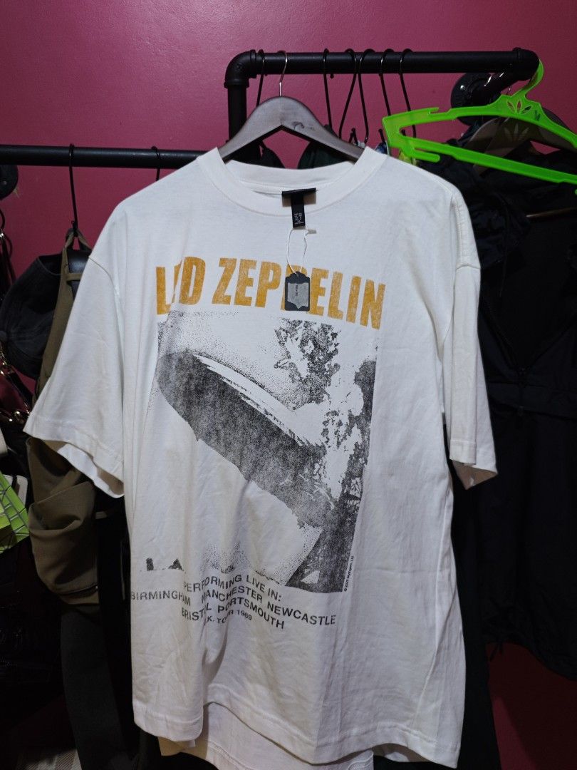 H&M Led Zeppelin Graphic T-Shirt (Category: Tshirts & Polo Shirts ) located in Muntinlupa City. Submitted by kidcht (Listing ID 1447303610, Image 1). Description: - White H&M T-Shirt - Vintage Led Zeppelin Graphic Print - Features Iconic Hindenburg Disaster Image - Large Fit, good for oversize fit - Ideal for Led Zeppelin Fans - Classic Band Tee.