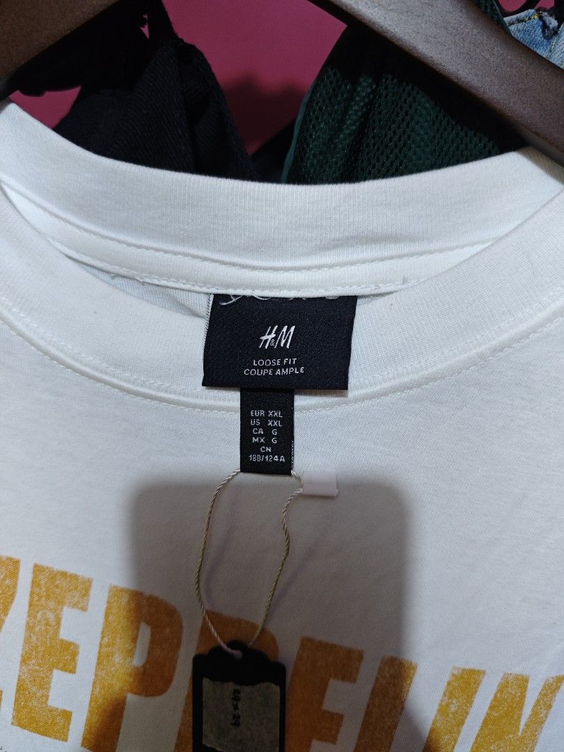 H&M Led Zeppelin Graphic T-Shirt (Category: Tshirts & Polo Shirts ) located in Muntinlupa City. Submitted by kidcht (Listing ID 1447303610, Image 2). Description: - White H&M T-Shirt - Vintage Led Zeppelin Graphic Print - Features Iconic Hindenburg Disaster Image - Large Fit, good for oversize fit - Ideal for Led Zeppelin Fans - Classic Band Tee.