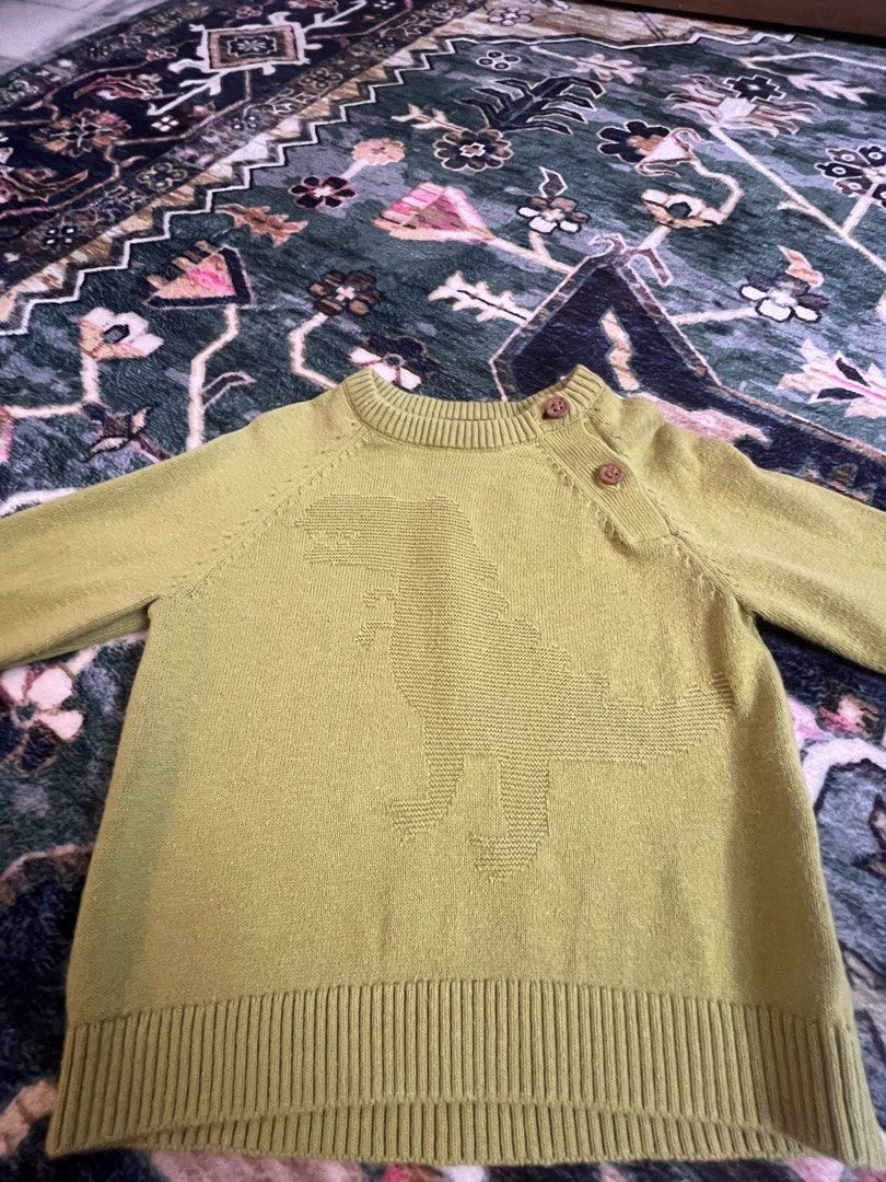 Kids Dinosaur Knit Sweater - Green (Category: Babies & Kids Fashion) located in Kuala Lumpur. Submitted by prelovedbyhisyam (Listing ID 1447429823, Image 2). Description: Negotiable - Cute green knit sweater for kids - Features a knitted dinosaur design on the front - Two wooden buttons at the shoulder for easy dressing - Ribbed cuffs and hem for a snug fit - Ideal for everyday wear and playtime.