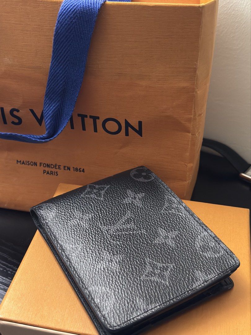 Louis Vuitton Monogram Eclipse Wallet (Category: Luxury Bags & Wallets) located in Manila. Submitted by boundxury (Listing ID 1447421615, Image 2). Description: - Authentic Louis Vuitton Wallet - Monogram Eclipse Canvas (Black & Grey) - Interior: Card slots & Bill compartment - Minor initialing inside ('J.C.') - Includes original box and dust bag - Ideal for everyday use.