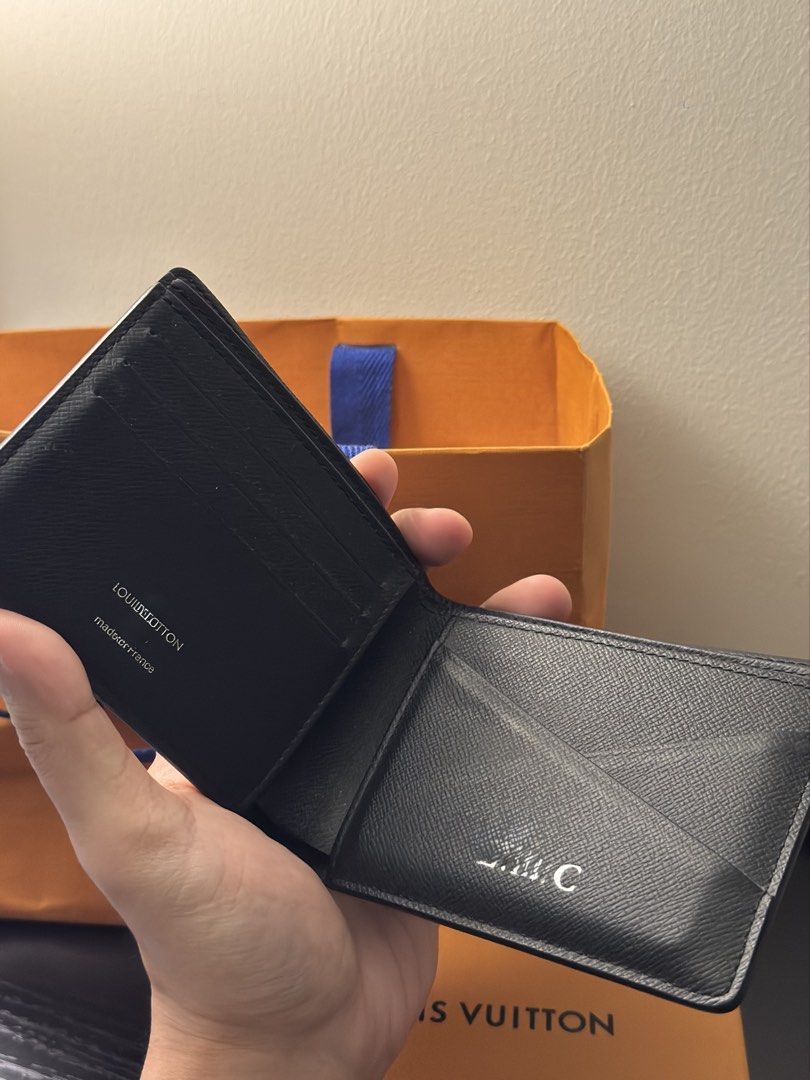 Louis Vuitton Monogram Eclipse Wallet (Category: Luxury Bags & Wallets) located in Manila. Submitted by boundxury (Listing ID 1447421615, Image 3). Description: - Authentic Louis Vuitton Wallet - Monogram Eclipse Canvas (Black & Grey) - Interior: Card slots & Bill compartment - Minor initialing inside ('J.C.') - Includes original box and dust bag - Ideal for everyday use.