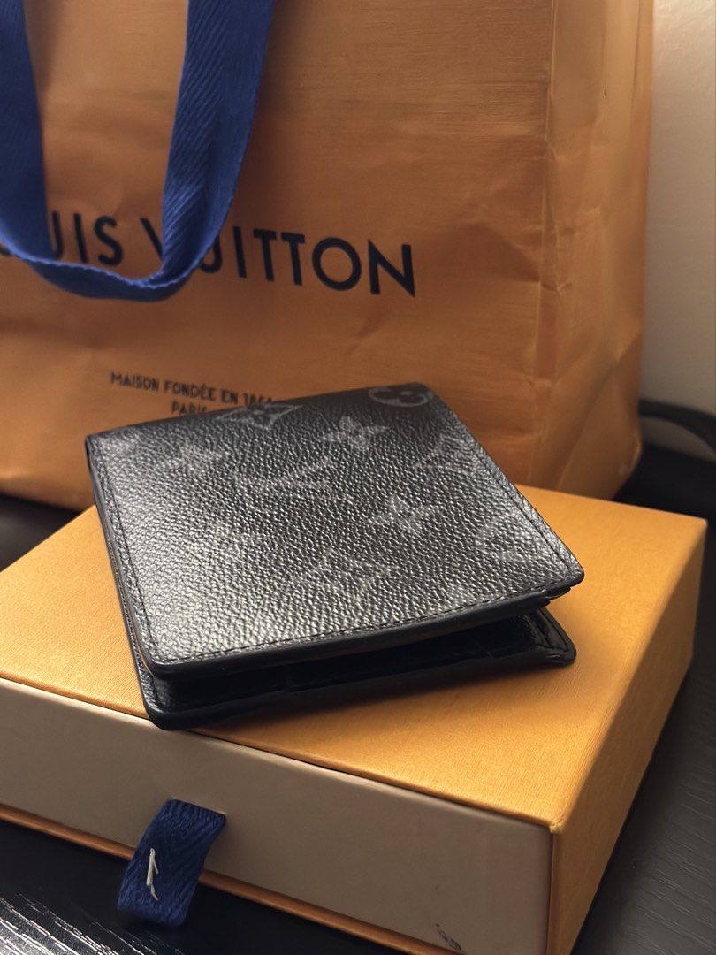 Louis Vuitton Monogram Eclipse Wallet (Category: Luxury Bags & Wallets) located in Manila. Submitted by boundxury (Listing ID 1447421615, Image 1). Description: - Authentic Louis Vuitton Wallet - Monogram Eclipse Canvas (Black & Grey) - Interior: Card slots & Bill compartment - Minor initialing inside ('J.C.') - Includes original box and dust bag - Ideal for everyday use.