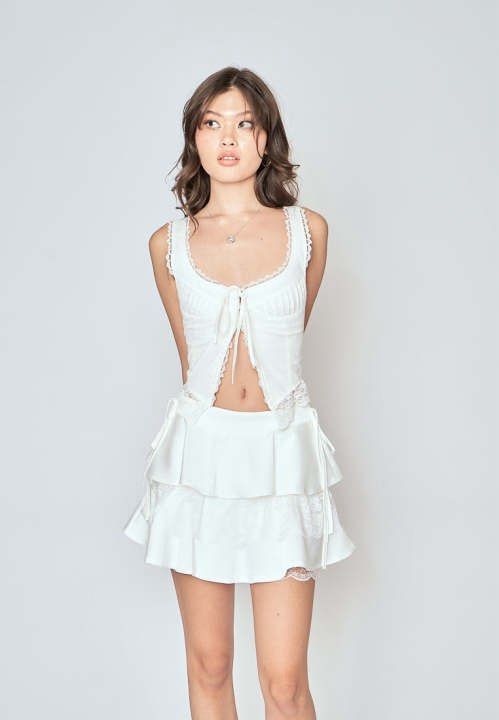 Love, Ara White Lace Trim Top (Category: Sleeveless) located in Bacoor. Submitted by decluttrdaily (Listing ID 1447463353, Image 2). Description: - Can be tied up for a cute, adjustable look - Versatile piece can be closed or open like the model in the picture.