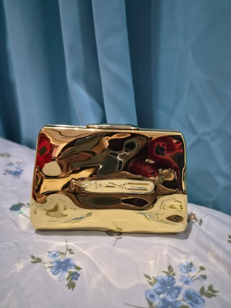 MAC Lipstick Set with Gold Case (Category: Makeup) located in Santo Tomas. Submitted by anacristin90526 (Listing ID 1447420343, Image 1). Description: - Authentic MAC lipstick set - Includes two popular shades: Teddy and Marrakesh - Comes in a beautiful, compartmented gold case - Ideal for personal makeup collection - Makes a perfect gift.