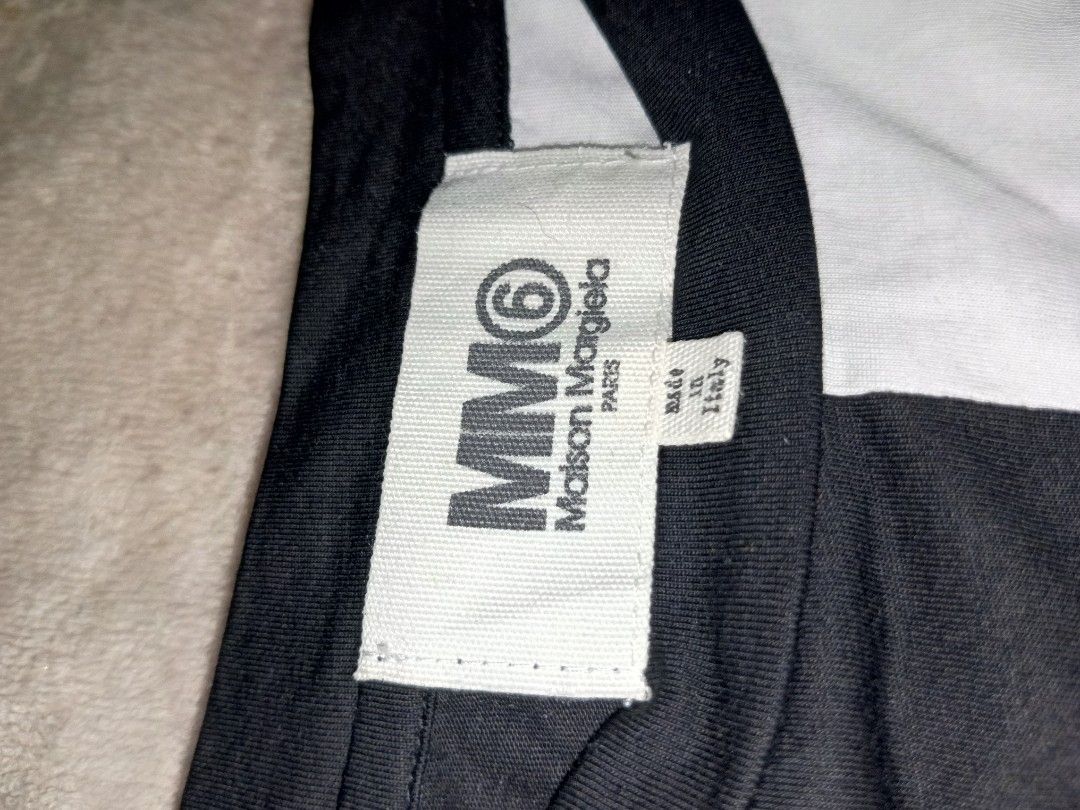 Maison Margiela 6 (Category: Activewear) located in San Pablo. Submitted by thriftyjd (Listing ID 1447445596, Image 2). Description: Maison Margiela 6 Plain half black and whiter Dimes: L27.5 x W22.5 large Condition/ color rate: 9/10 No Issue.