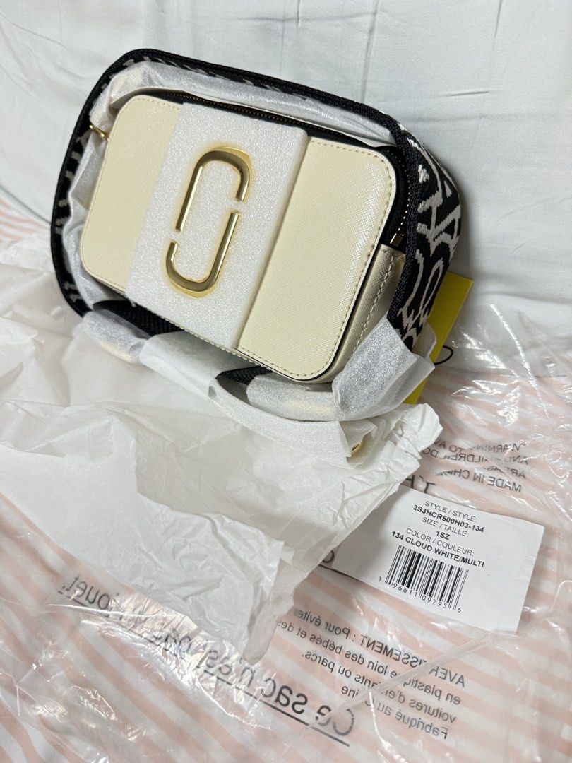 Marc Jacobs Snapshot Camera Bag Cloud White Multi (Category: Luxury Bags & Wallets) located in Pasig City. Submitted by decluttercentral515 (Listing ID 1447398184, Image 1). Description: - Brand: Marc Jacobs - Model: Snapshot Bag - Color: Cloud White Multi - Condition: Brand new, unused - Includes: Original strap, original tag - Perfect for: Everyday use, travel.